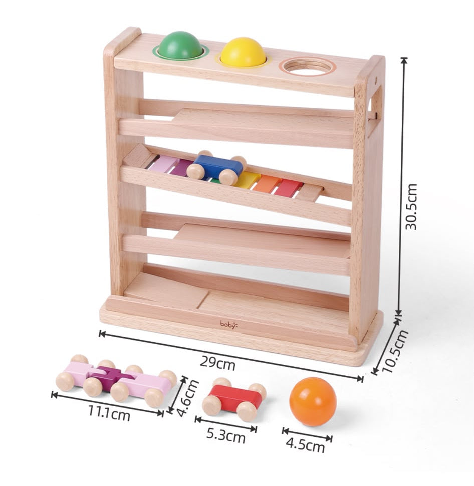 Montessori ball drop and car ramp activity for toddlers with wooden balls and cars
