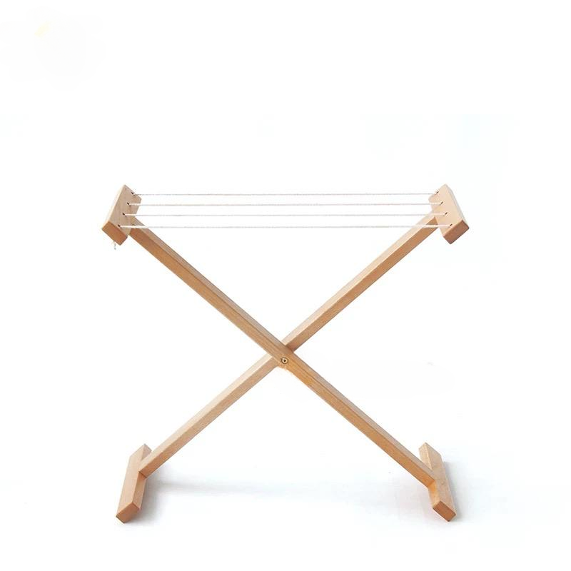 Montessori wooden clothes drying rack with dimensions shown for toddler practical life activities