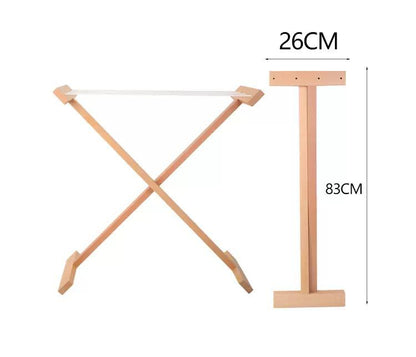 Montessori clothes drying rack in use with small cloths clipped for infant and toddler practical life