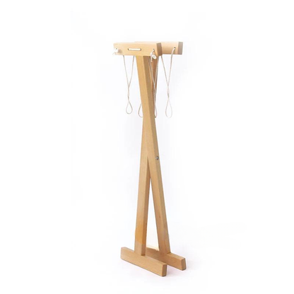 Side angle view of wooden Montessori clothes drying rack showing stable folding frame