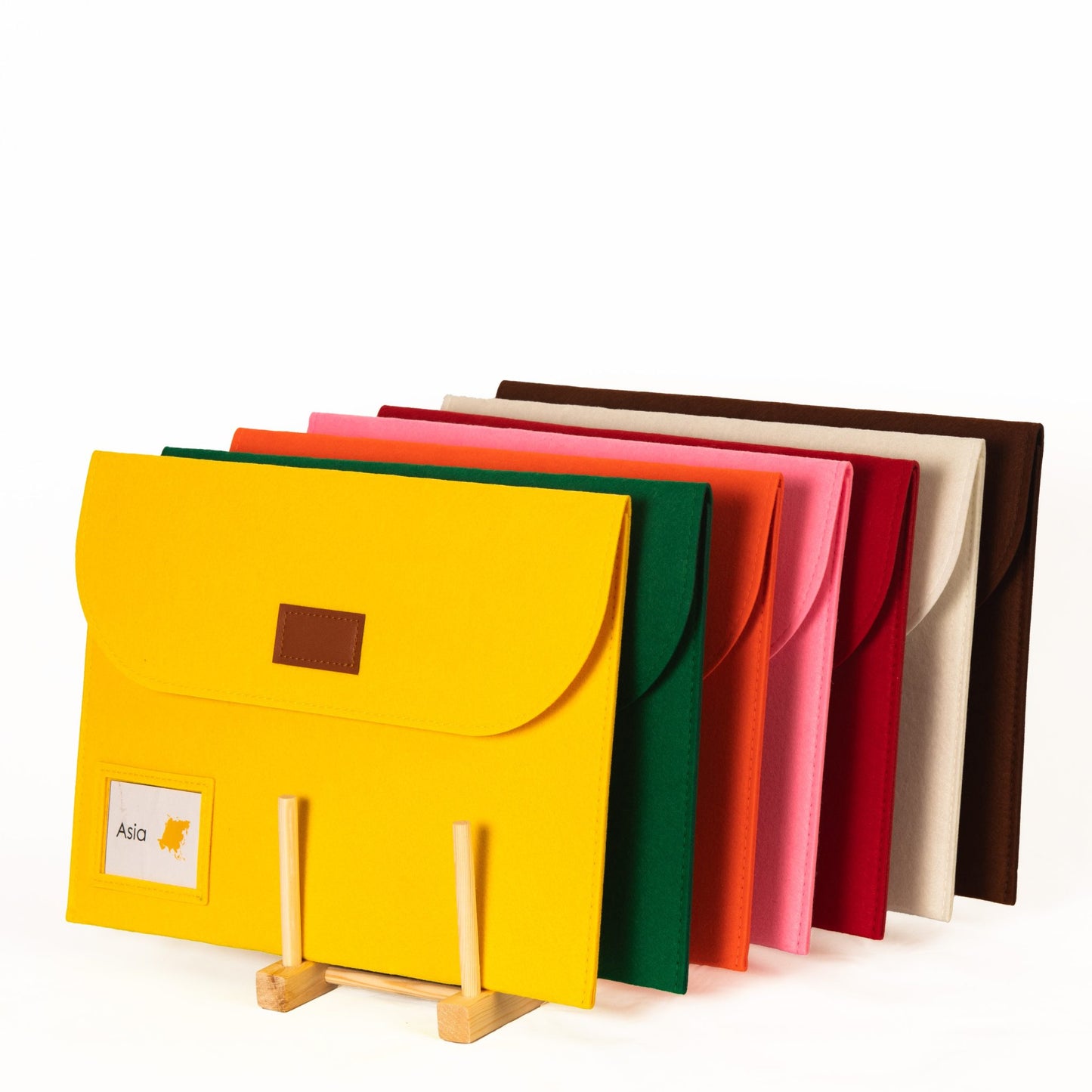 Montessori continent animal felt storage pouches displayed on wooden stand