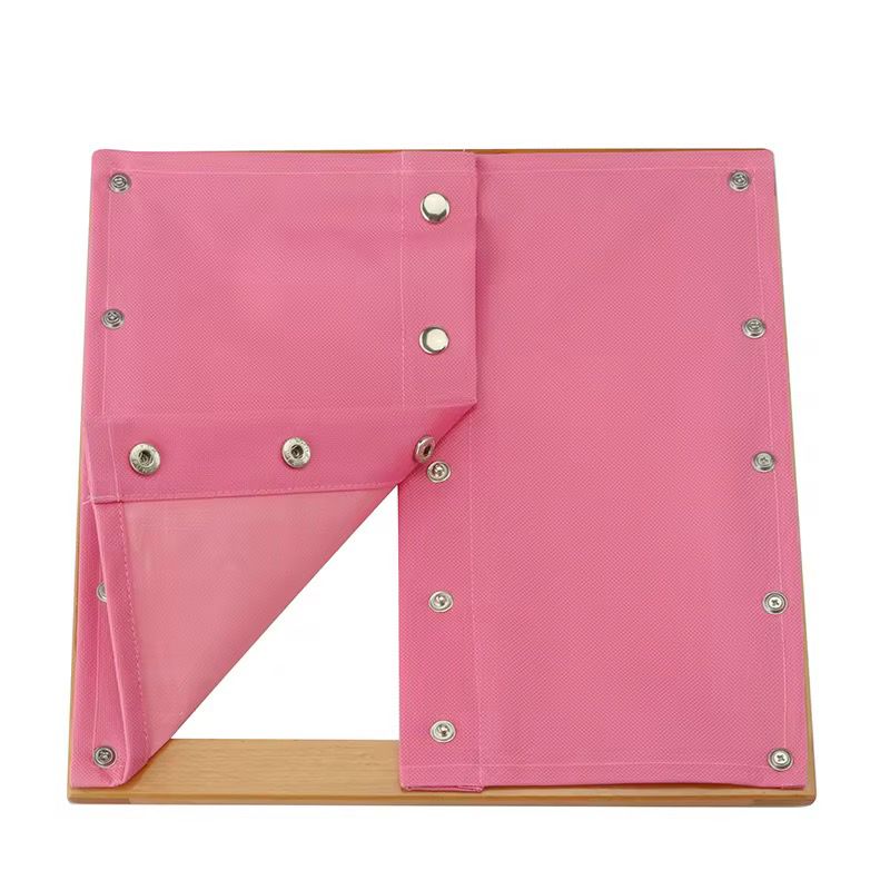 Montessori snap dressing frame showing open snap buttons, practical life activity for fine motor skill development