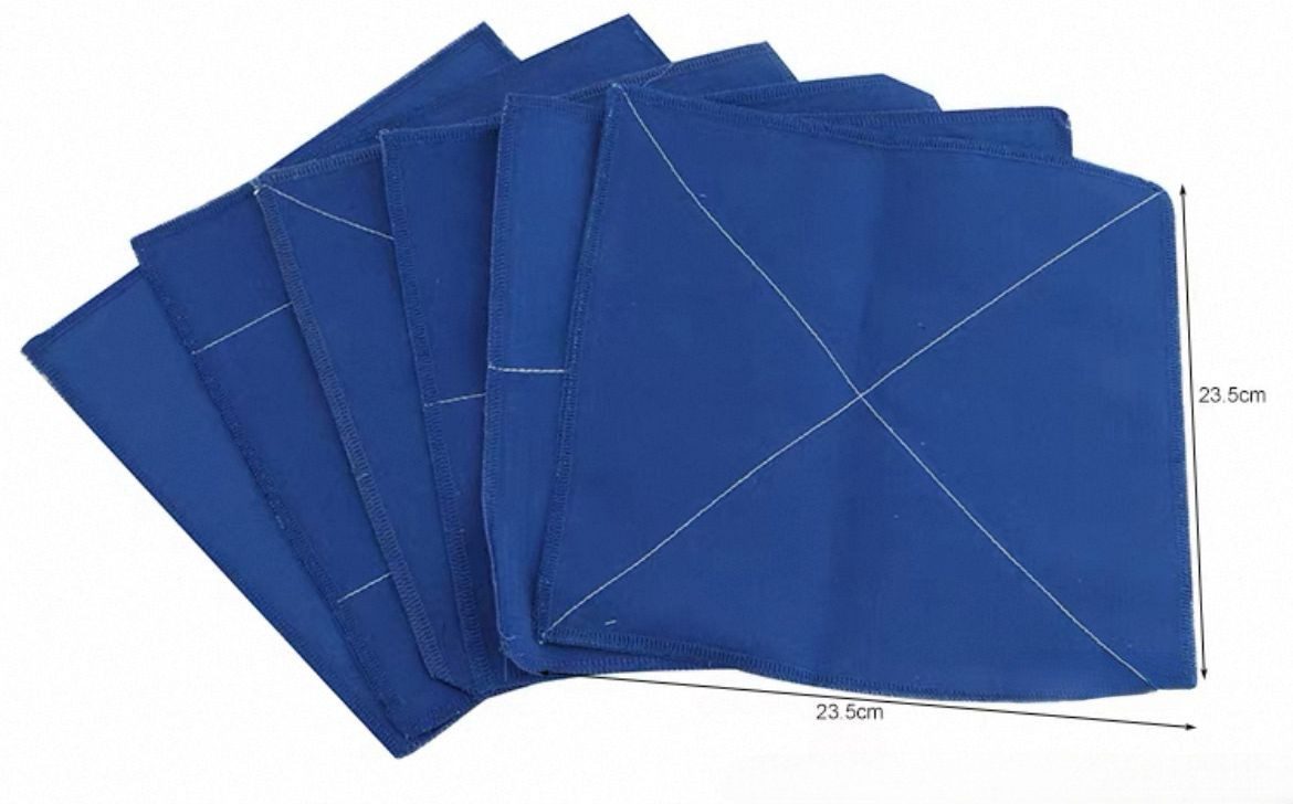Montessori practical life folding cloths stacked together showing stitched folding guides