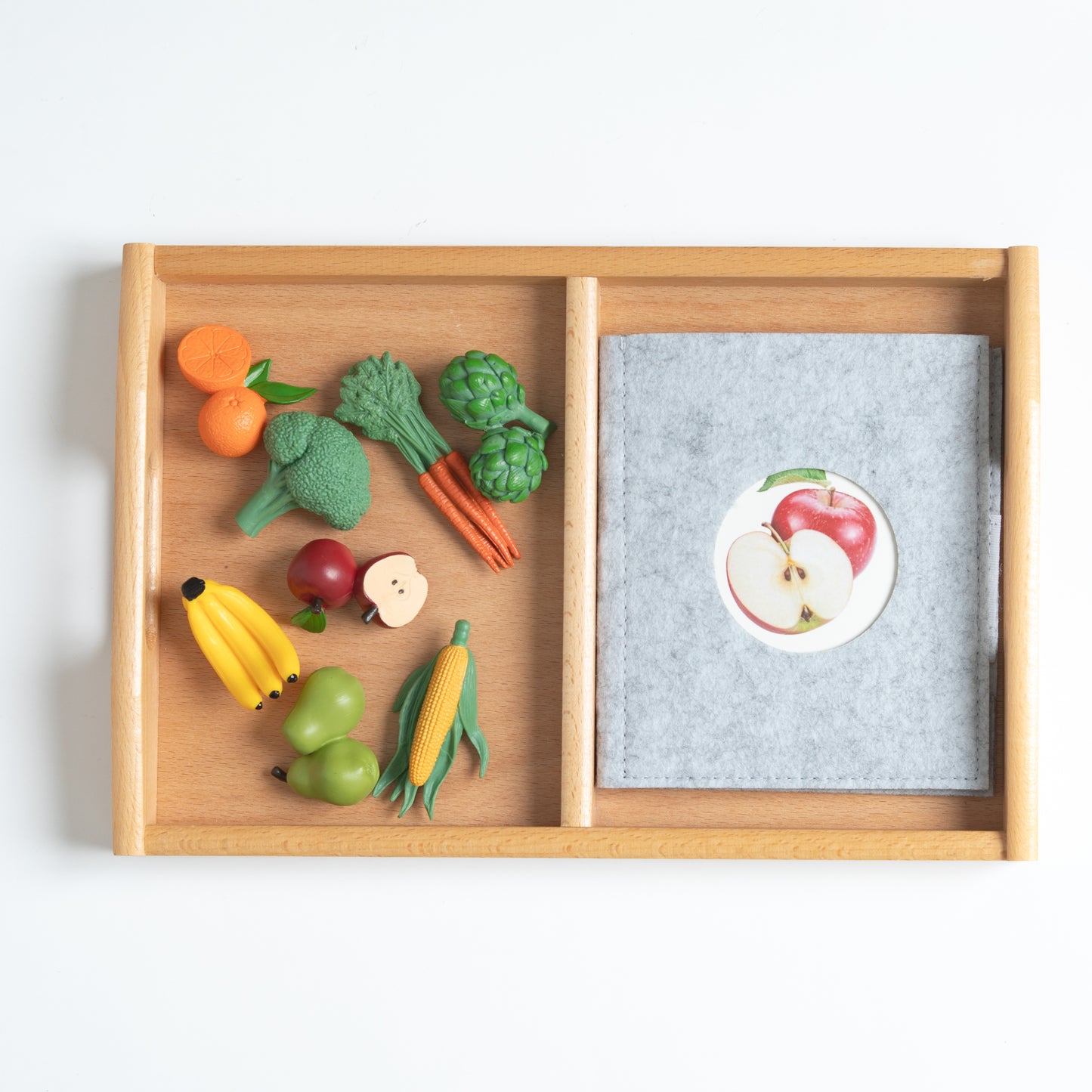 Montessori mini fruits and vegetables objects used for classification and hands-on learning activities