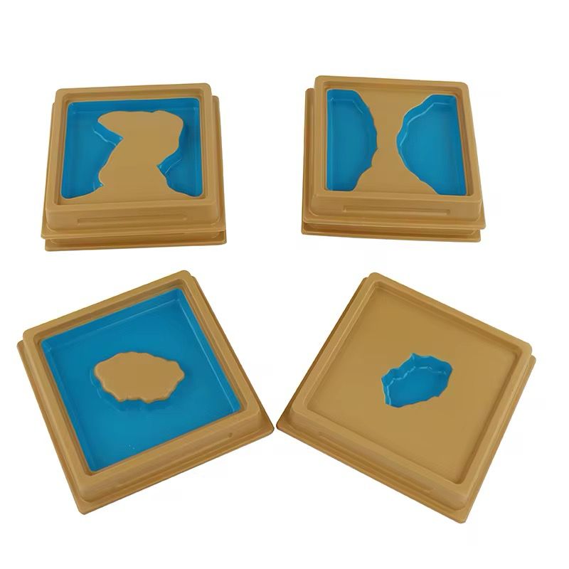 Montessori land and water form trays displayed individually for geography concept learning