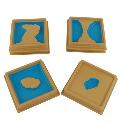 Montessori land and water form trays displayed individually for geography concept learning