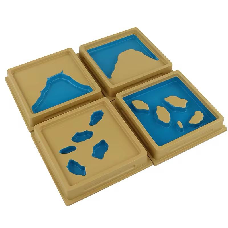 Montessori land and water forms set 2 showing bay, strait, isthmus, and channel trays
