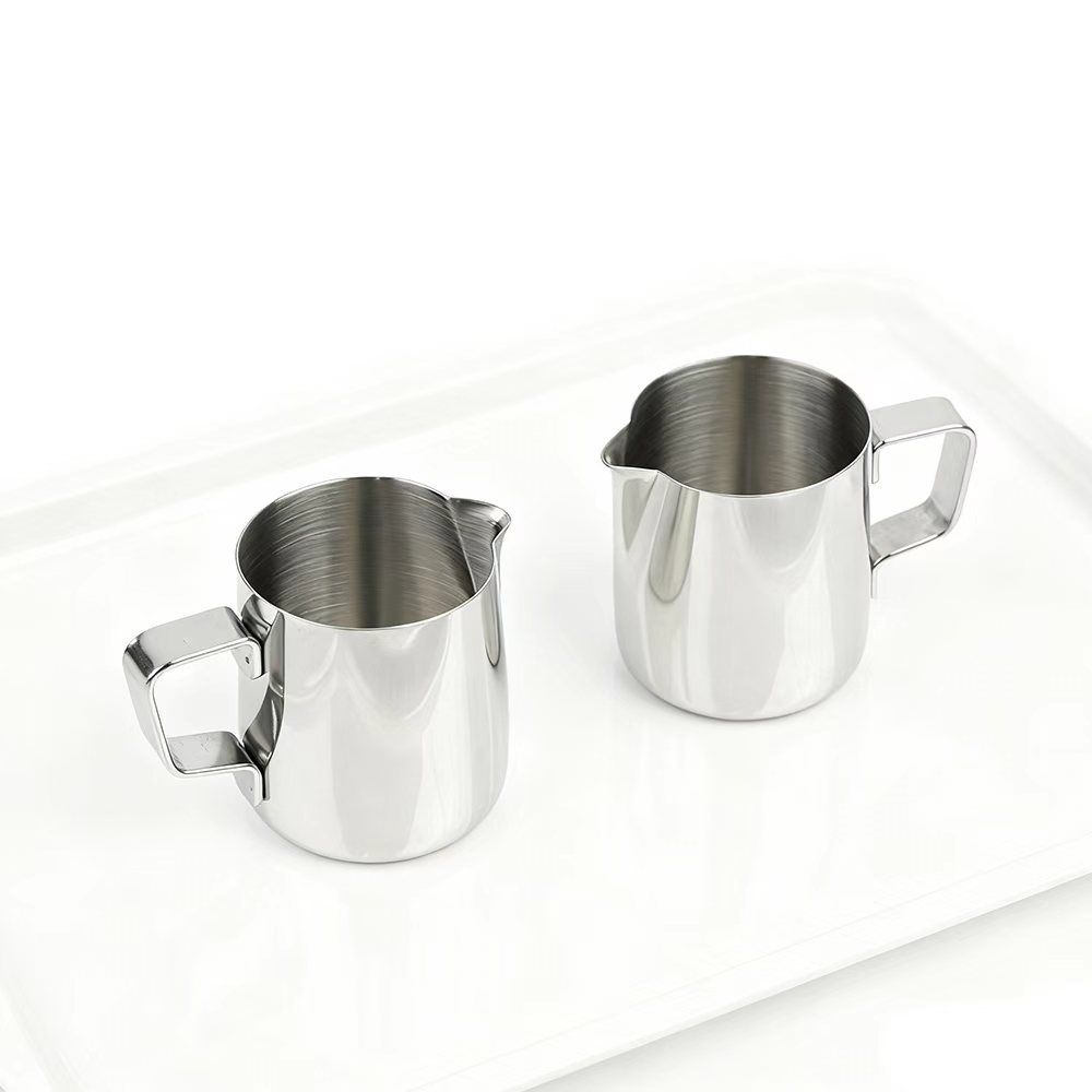 Side angle view of Montessori steel pitcher for liquid transfer activity