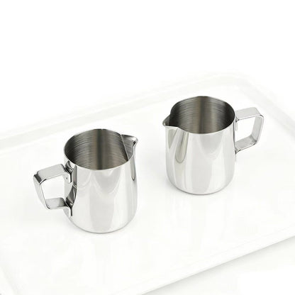 Side angle view of Montessori steel pitcher for liquid transfer activity