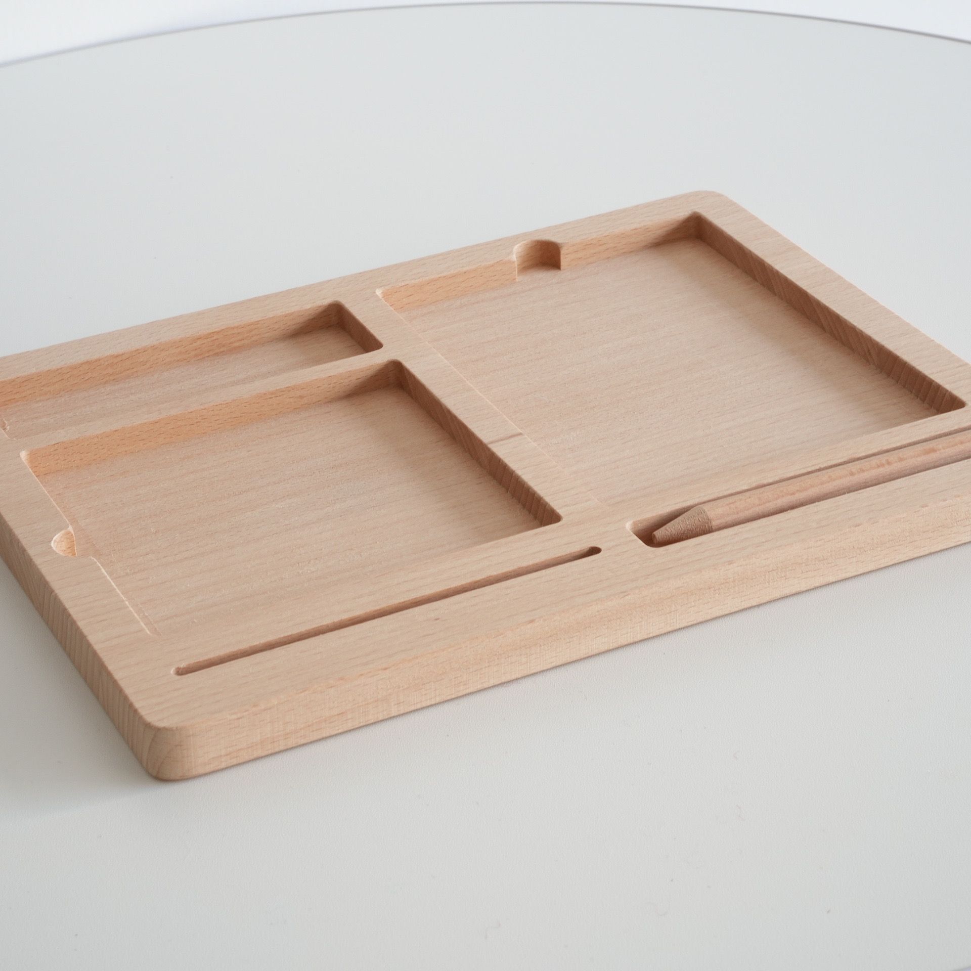 Angled view of wooden Montessori tray for organizing three part cards