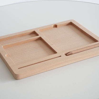 Angled view of wooden Montessori tray for organizing three part cards