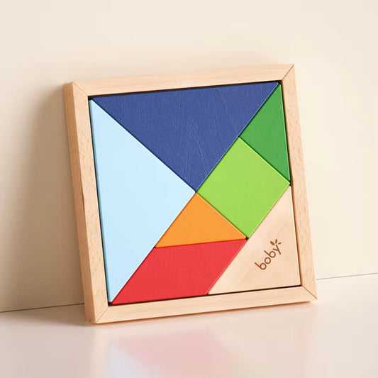 Montessori wooden tangram puzzle board with colorful geometric pieces, designed to develop spatial awareness, logical thinking, problem-solving, creativity, and fine motor skills for toddlers and preschoolers