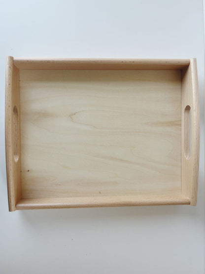 Side view of Montessori wooden tray with raised edges for practical life work