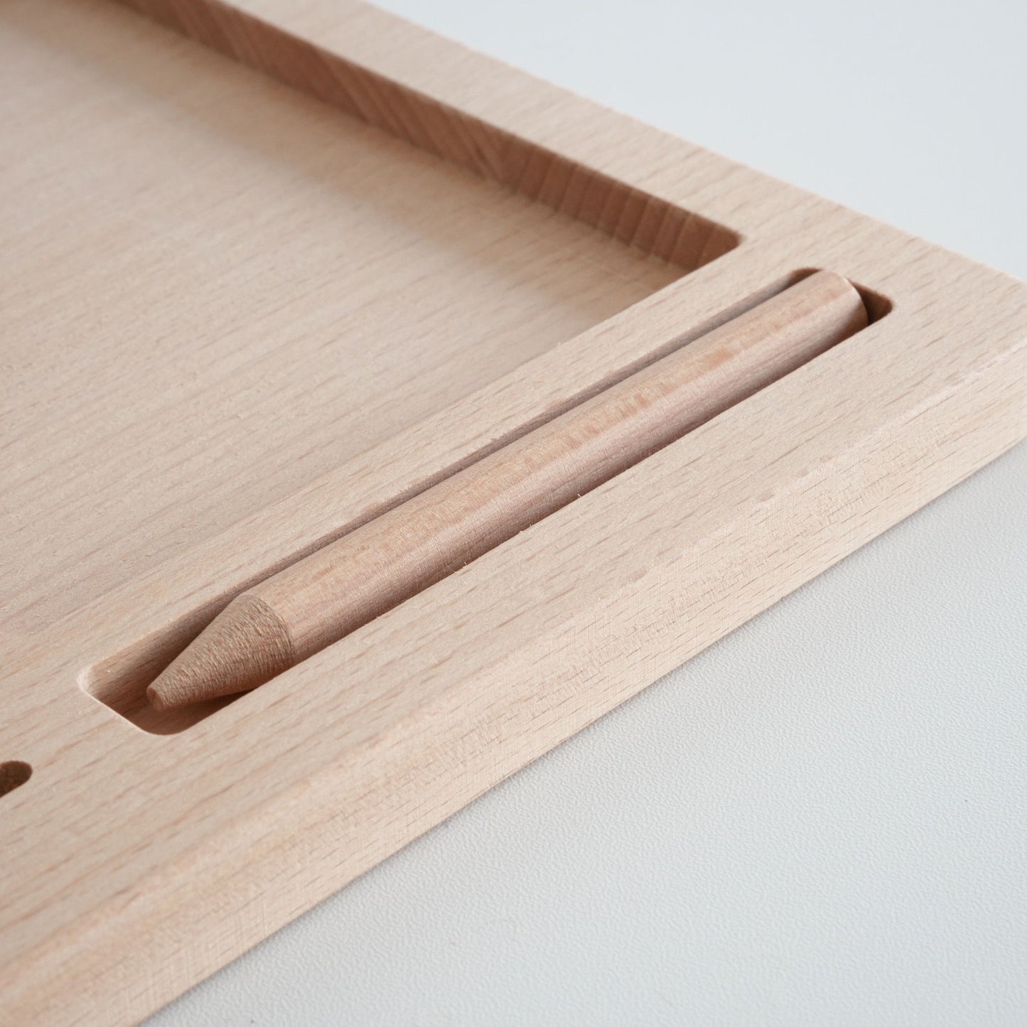 Close up of wooden Montessori tray slot for classified cards