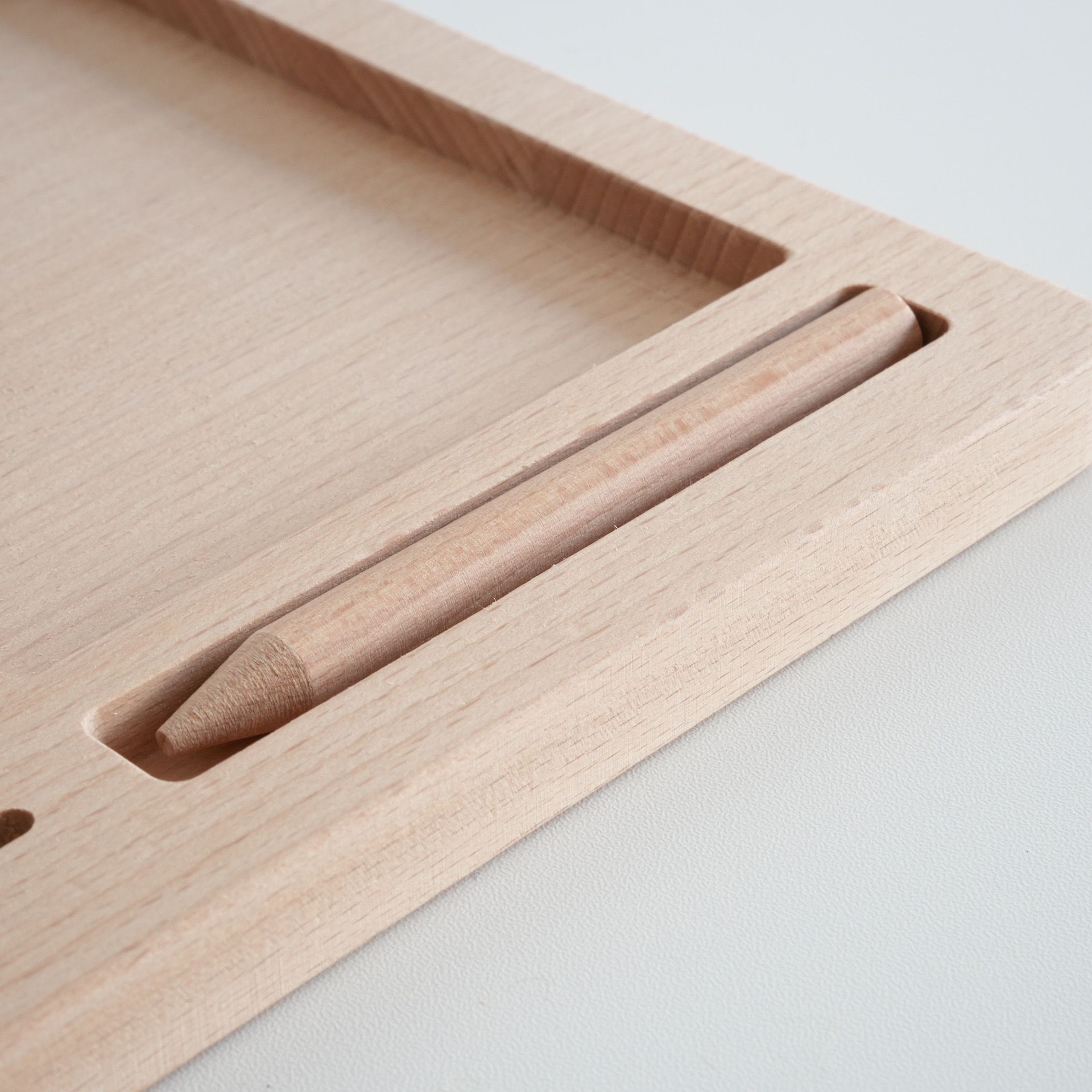 Close up of wooden Montessori tray slot for classified cards