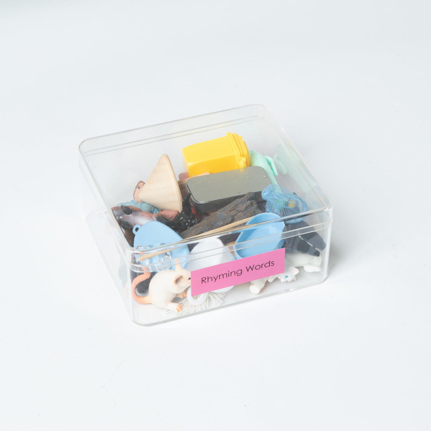 Montessori Pink Series rhyming words matching set stored in transparent box with miniature objects for classroom phonics activities