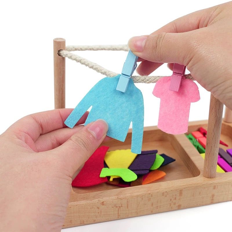 Practical Life clothesline work in Montessori toddler classroo