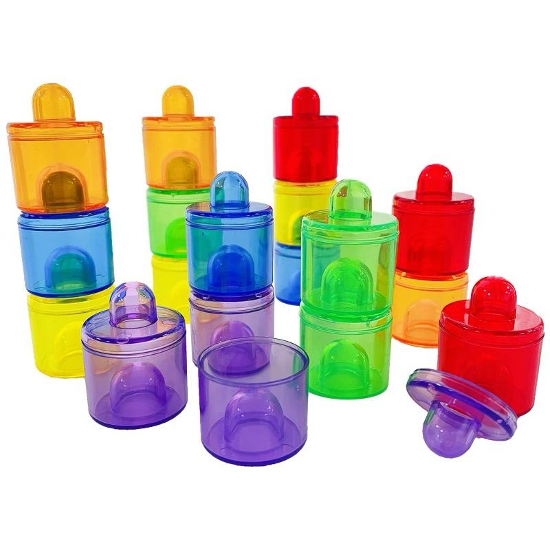 Graduated rainbow beakers used for pouring and measuring water activities