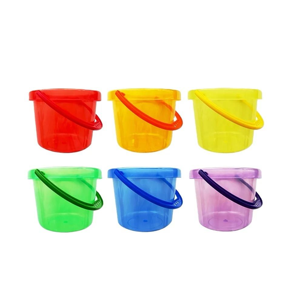Rainbow measuring cups arranged for volume comparison activities