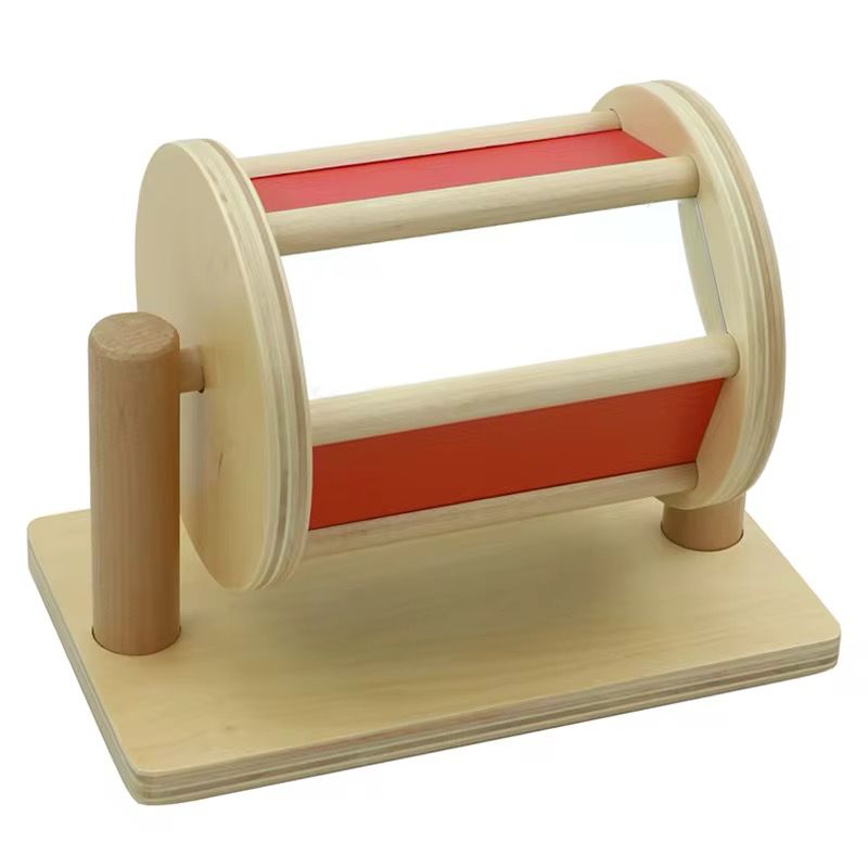 Side angle of Montessori spinning drum toy for visual tracking and fine motor skills