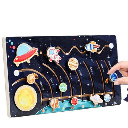 Solar system puzzle board showing removable planet pieces for interactive space learning activity