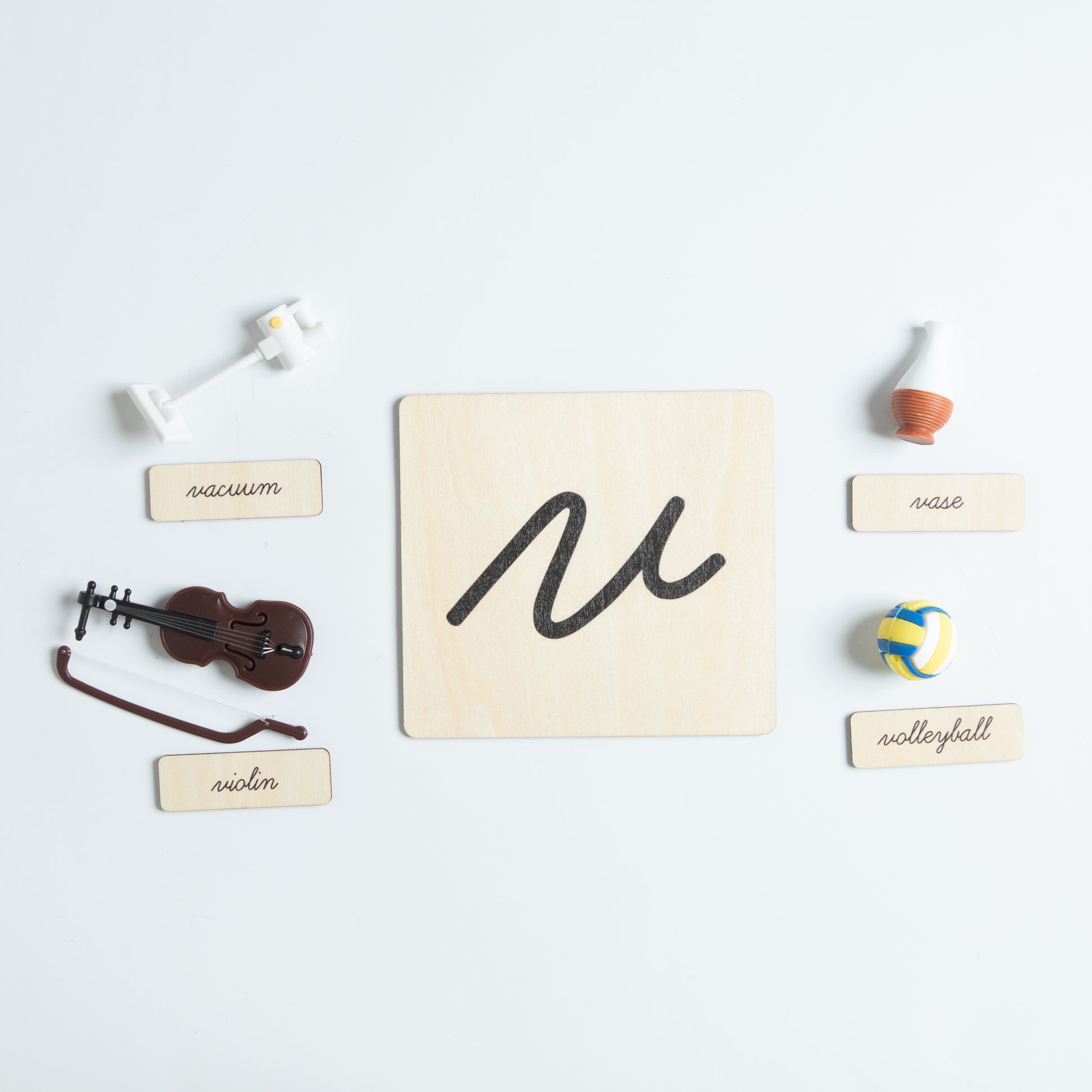 Montessori sound pouch for letter H with cursive card and mini objects