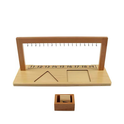 Empty Montessori teen bead hanger with hooks and wooden number cards placed below, showing the layout for numbers 11 to 19.