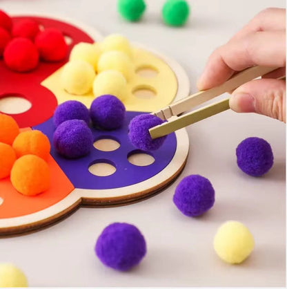 Toddler pom pom color sorting game designed to improve hand-eye coordination and fine motor skills