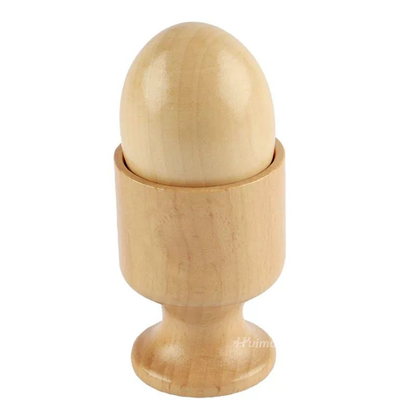 Natural wooden Montessori toy featuring a smooth wooden ball placed inside a matching wooden cup stand on a light background.
