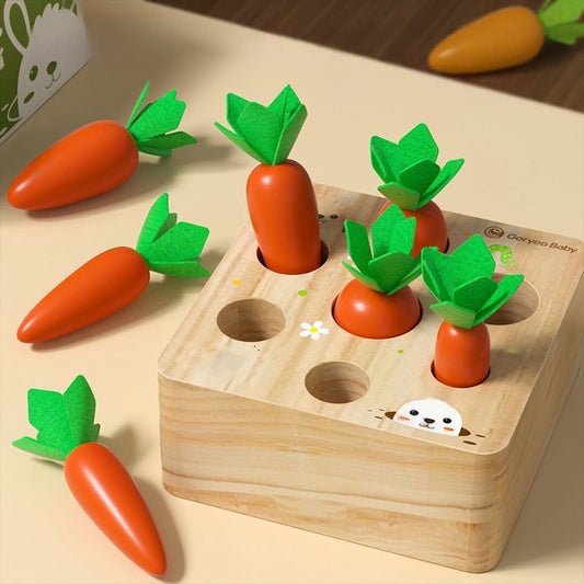Toddler playing with wooden carrot harvesting puzzle to develop fine motor skills