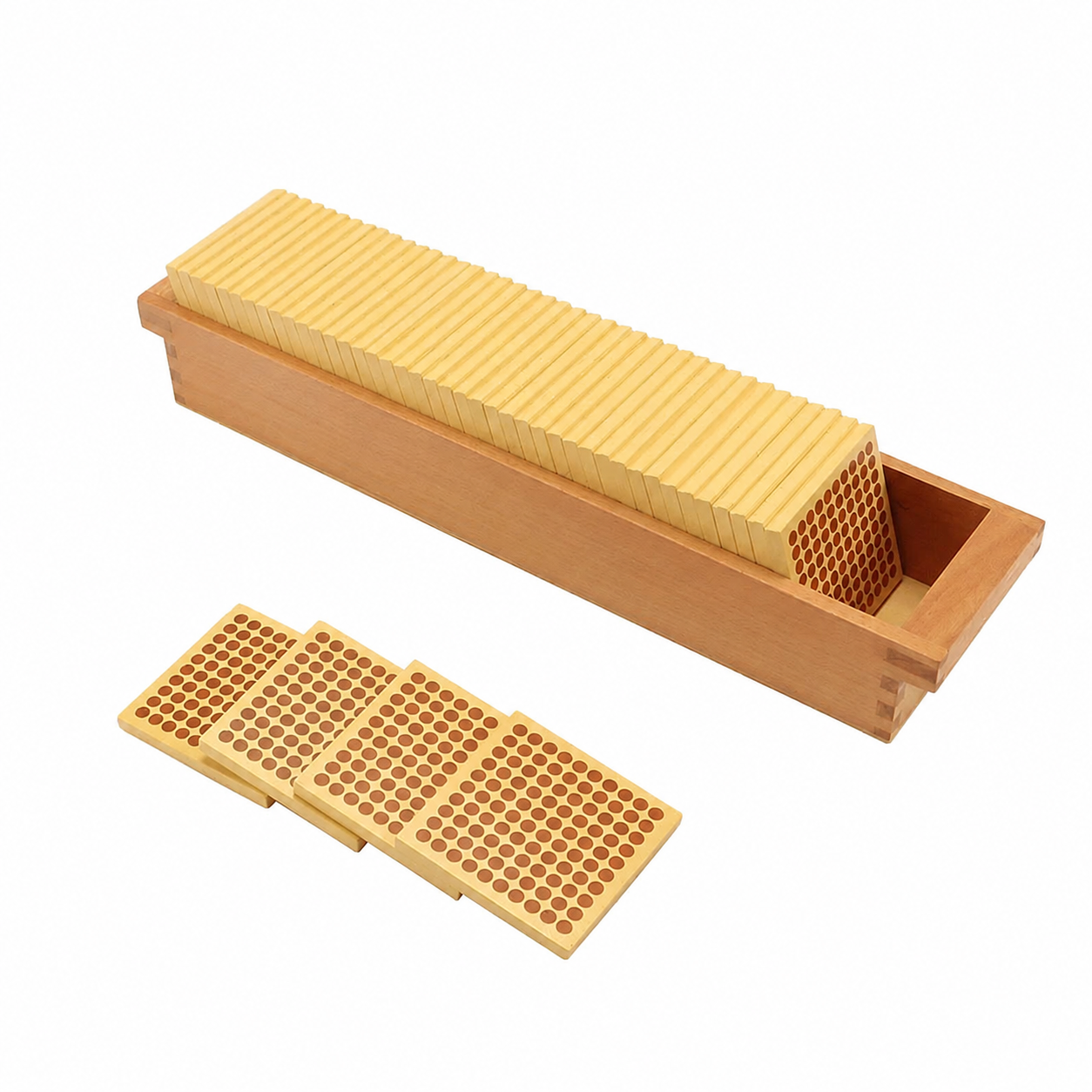 Wooden tray containing stacked honeycomb-pattern blocks with four perforated rectangular tiles placed in front on a light background