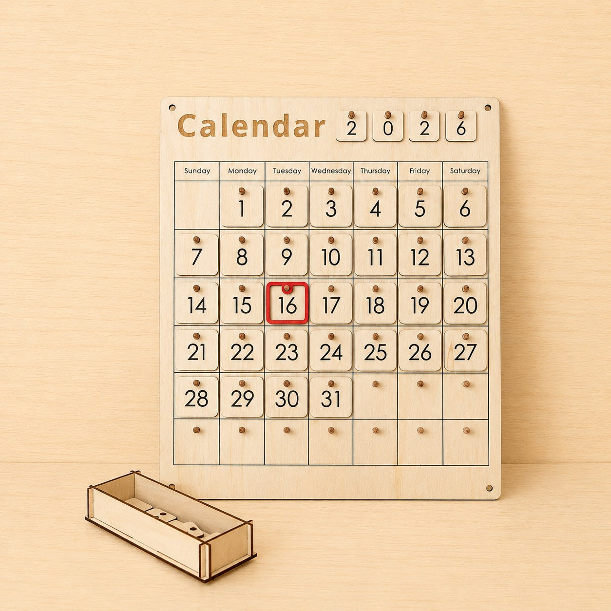 Wooden Montessori calendar with movable date pieces and weekly calendar grid